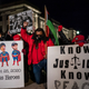 Justin Blake (C) leads a protest march past the Kenosha County Courthouse after the jury retired for the evening in the trial of Kyle Rittenhouse on November 17, 2021, in Kenosha, Wisconsin. Rittenhouse is accused of shooting three demonstrators, killing two of them, during a night of unrest that erupted in Kenosha after a police officer shot Jacob Blake seven times in the back while being arrested in August 2020. Rittenhouse, from Antioch, Illinois, was 17 at the time of the shooting and armed with an assault rifle. He faces counts of felony homicide, and felony attempted homicide.
